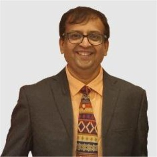 Abhinandan Popatlal Dagale, COO of Zebion, smiling in professional attire